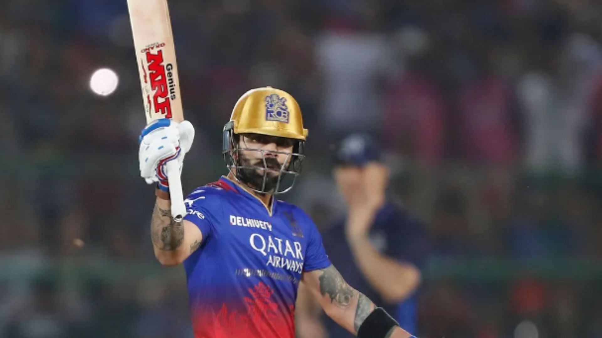 Kohli acknowledges the crowd after scoring a century against RR.